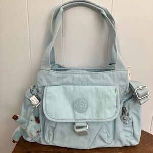 Kipling Light Blue Shoulder Bag with Plush Accessory